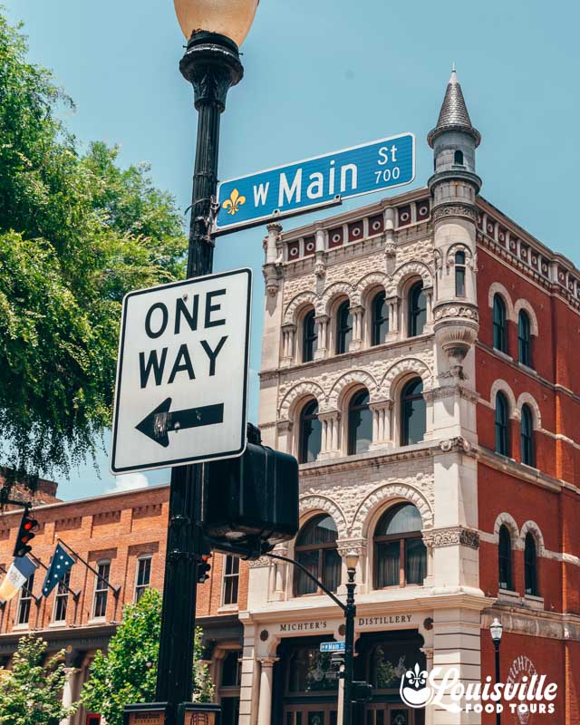 Main street sign in front of Michters distillery in Louisville Kentucky's historic downtown