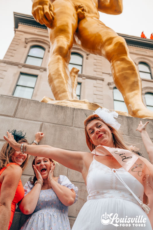 Bachelorette group in front of statue of David in downtown Louisville