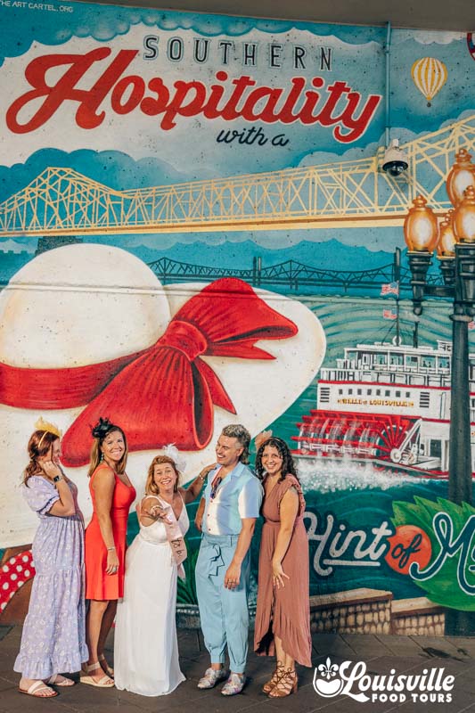 Bachelorette group in front of mural in downtown Louisville
