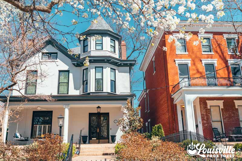 Historic Victorian homes in the Original Highlands in the spring with blooming flowers in Louisville, Kentucky